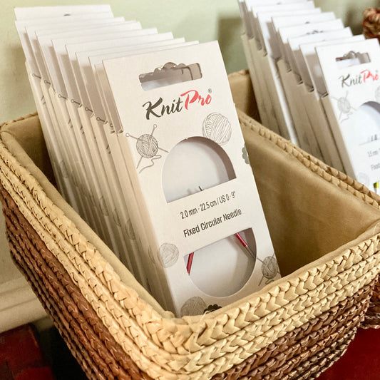 Basket of KnitPro Zing 9” circular knitting needles.