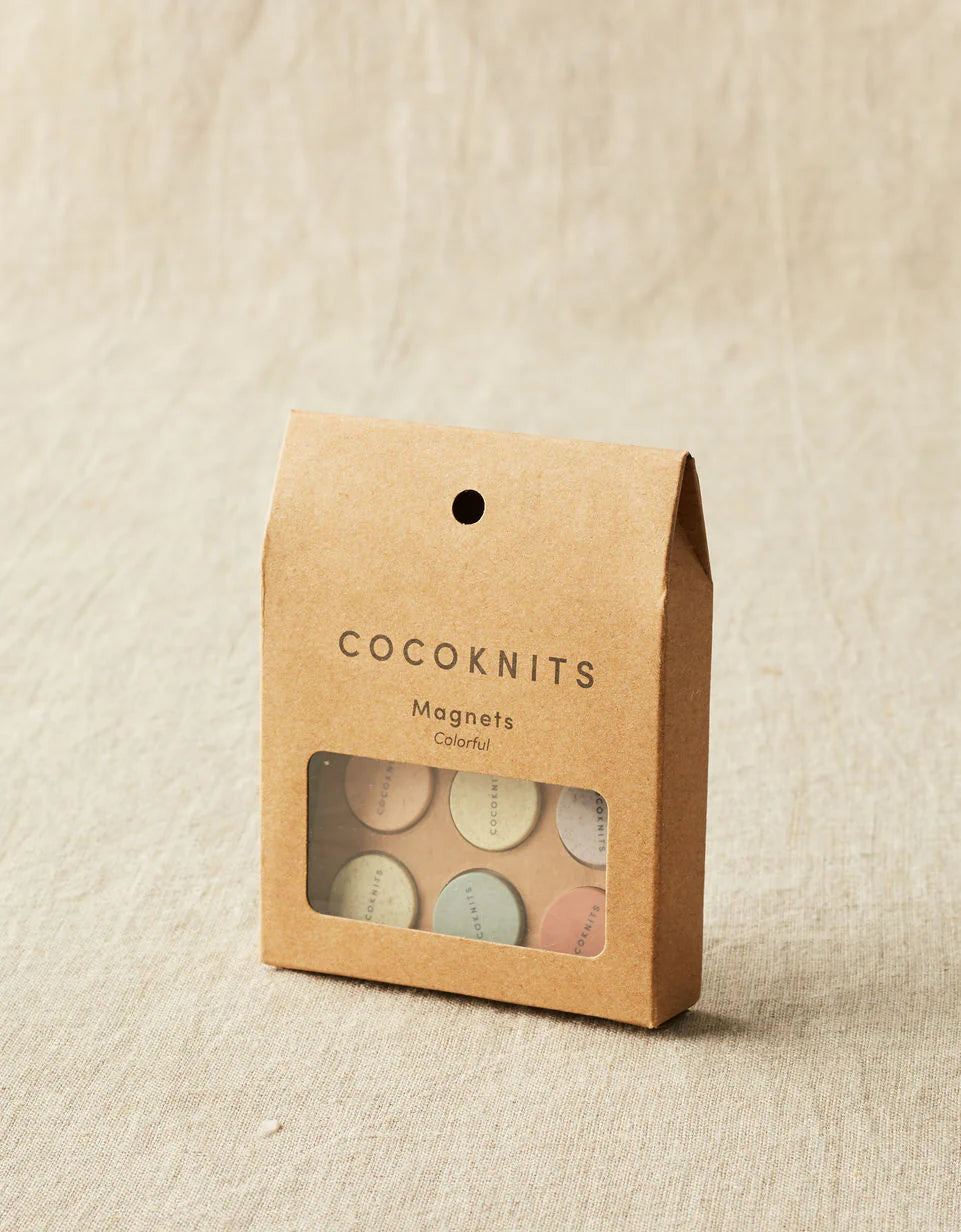 Kraft brown box of cocoknits magnets.
