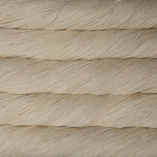 Skein of natural white Malabrigo Arroyo yarn.