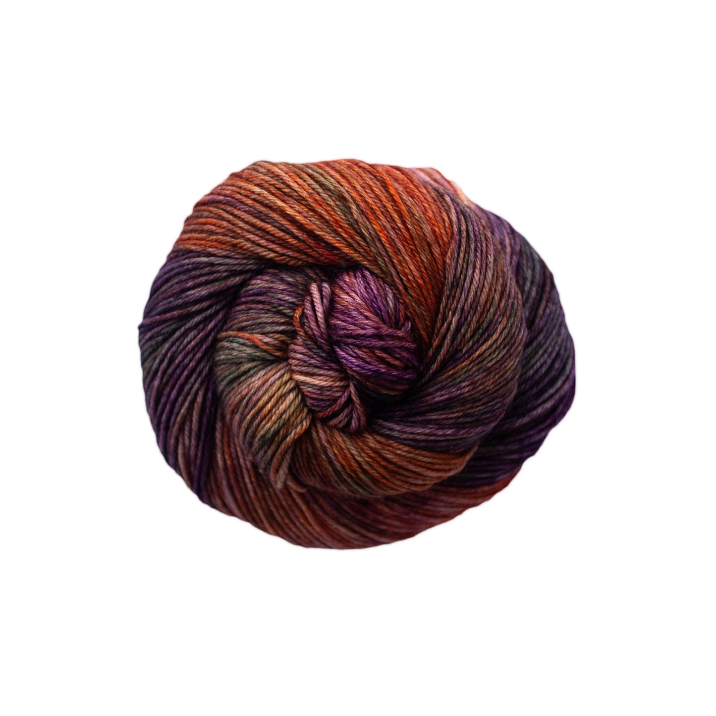 Skein of variegated orange, brown, and burgundy Malabrigo Arroyo yarn.