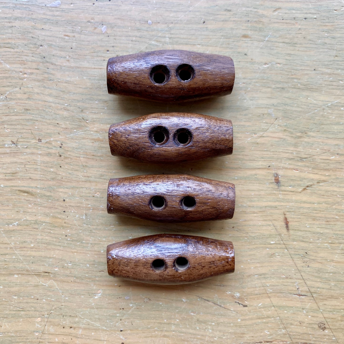 Nature’s Wonders toggle buttons in black walnut