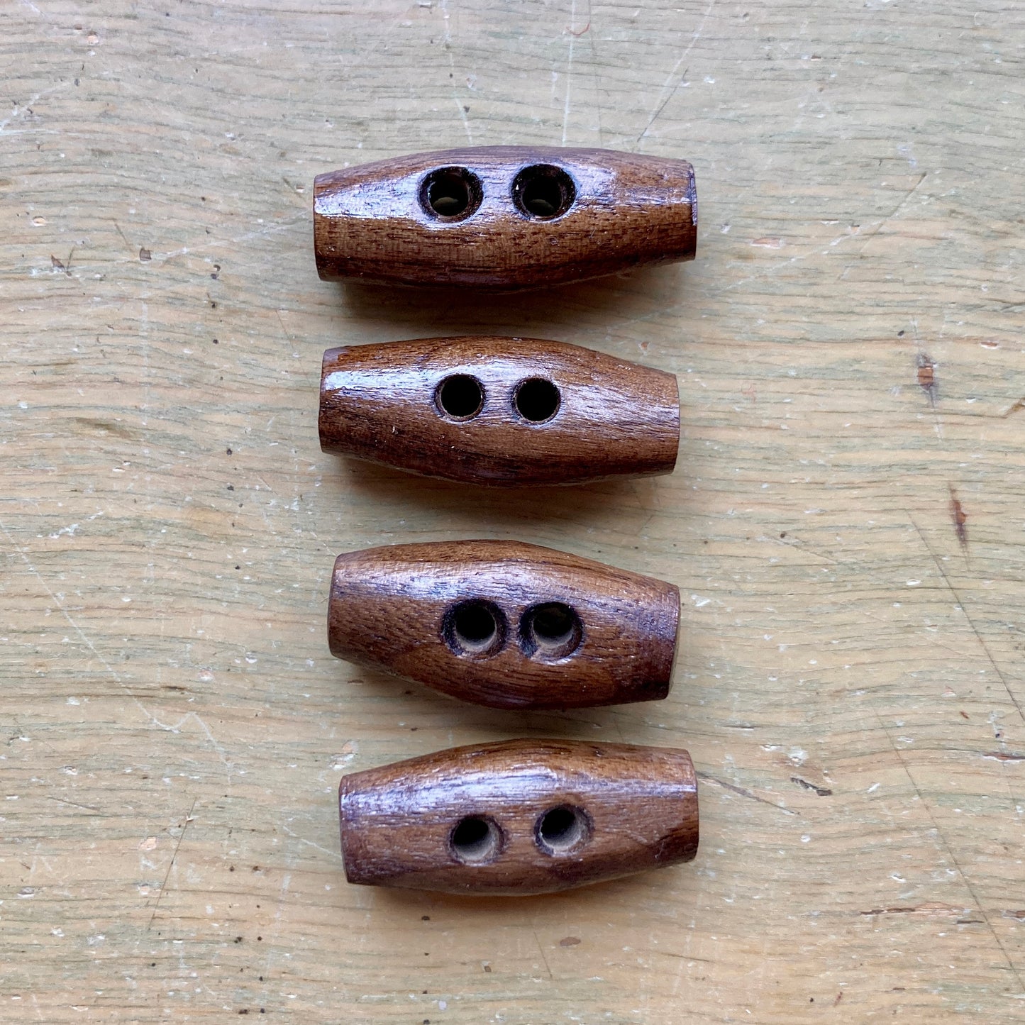 Nature’s Wonders toggle buttons in walnut