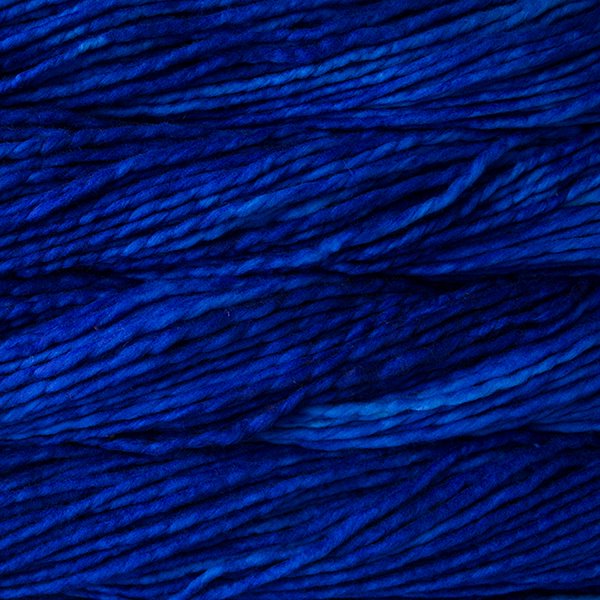Close up on cobalt blue skein of Malabrigo Rasta yarn.