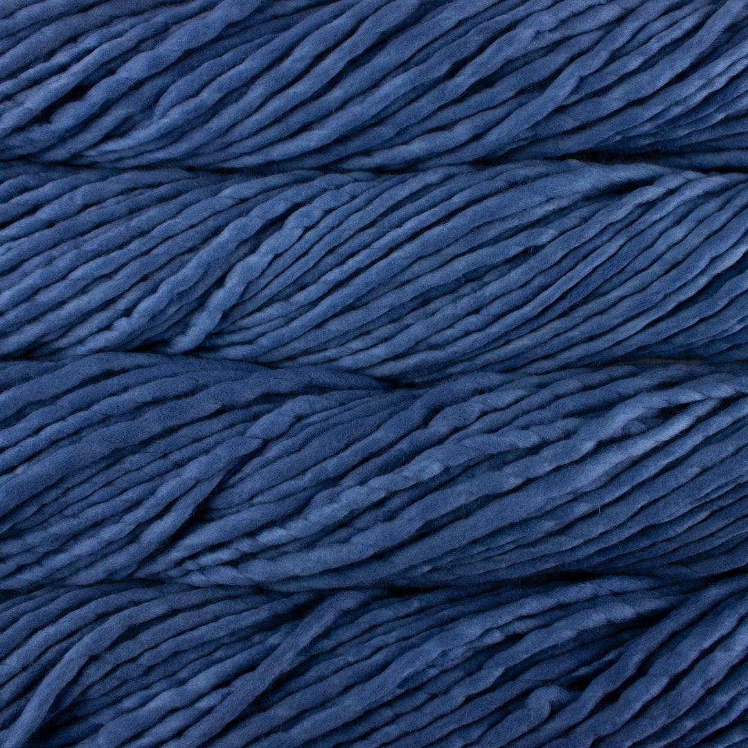 Close up on denim blue skein of Malabrigo Rasta yarn.