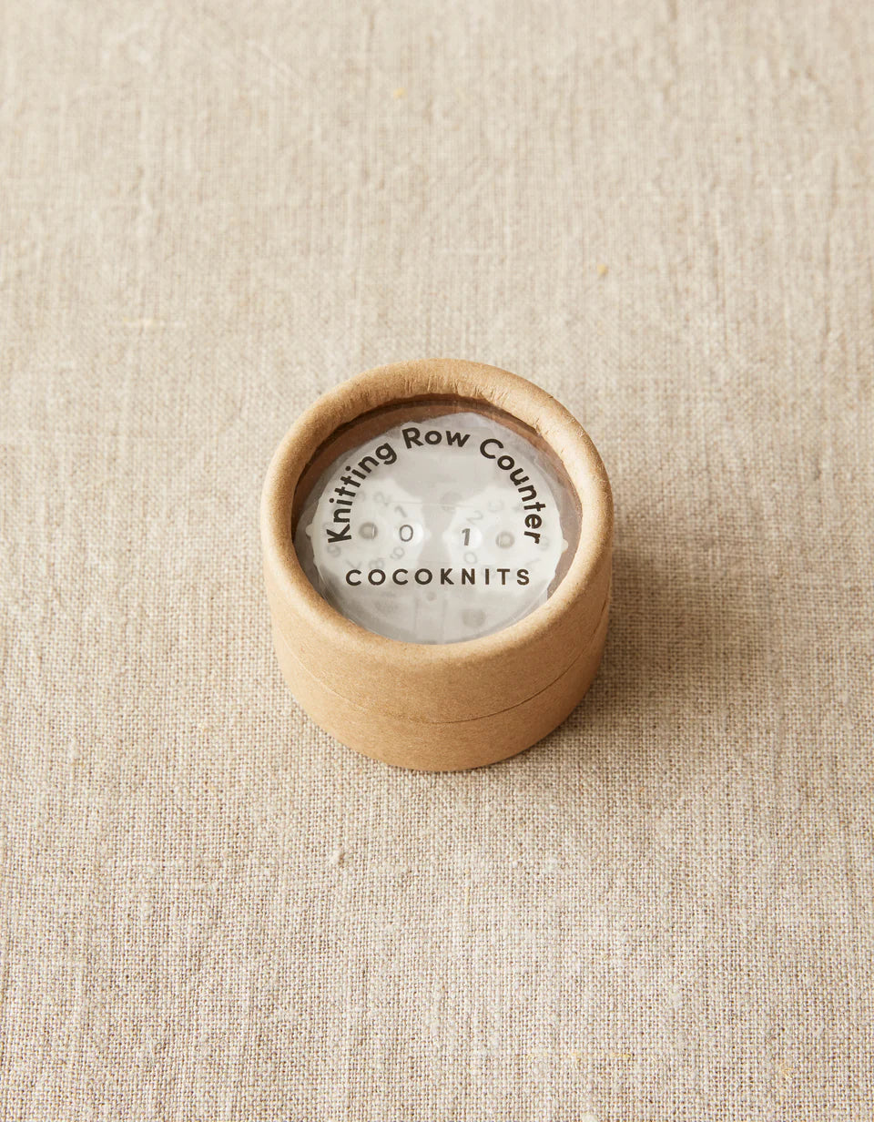 Kraft brown package with cocoknits row counter inside.