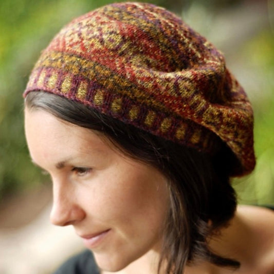 Person wearing handknit colorwork tam.