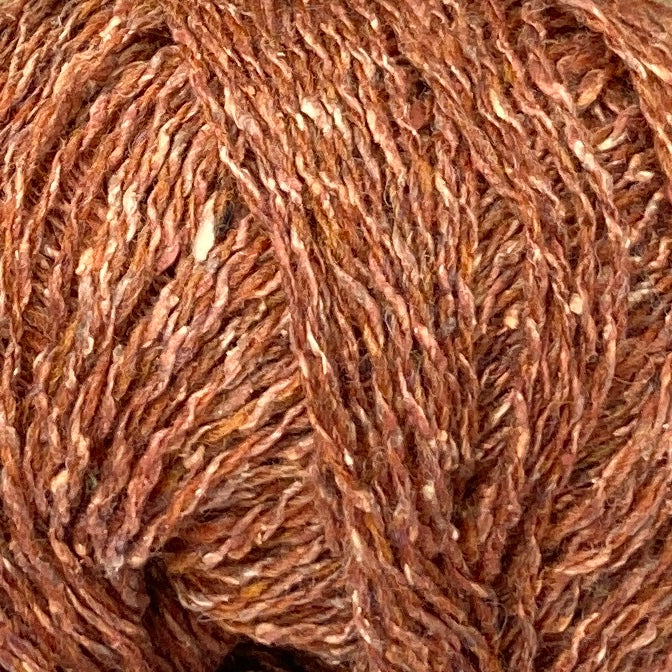 Close up on ball of Simply Shetland Silk & Lambswool yarn in tweedy brick rust, colorway Ardvreck