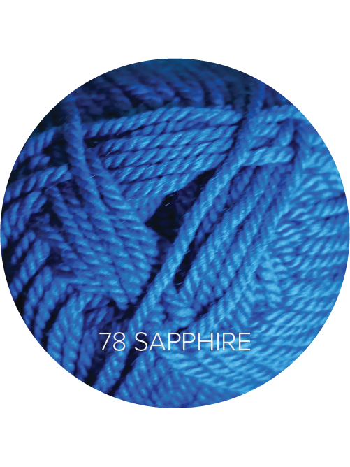 Close up on a royal blue ball of Ewe Ewe Baa Baa Bulky yarn.