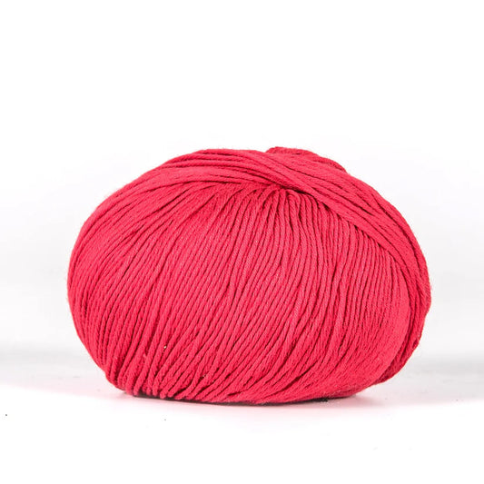 Ball of red BC Garn Alba yarn.