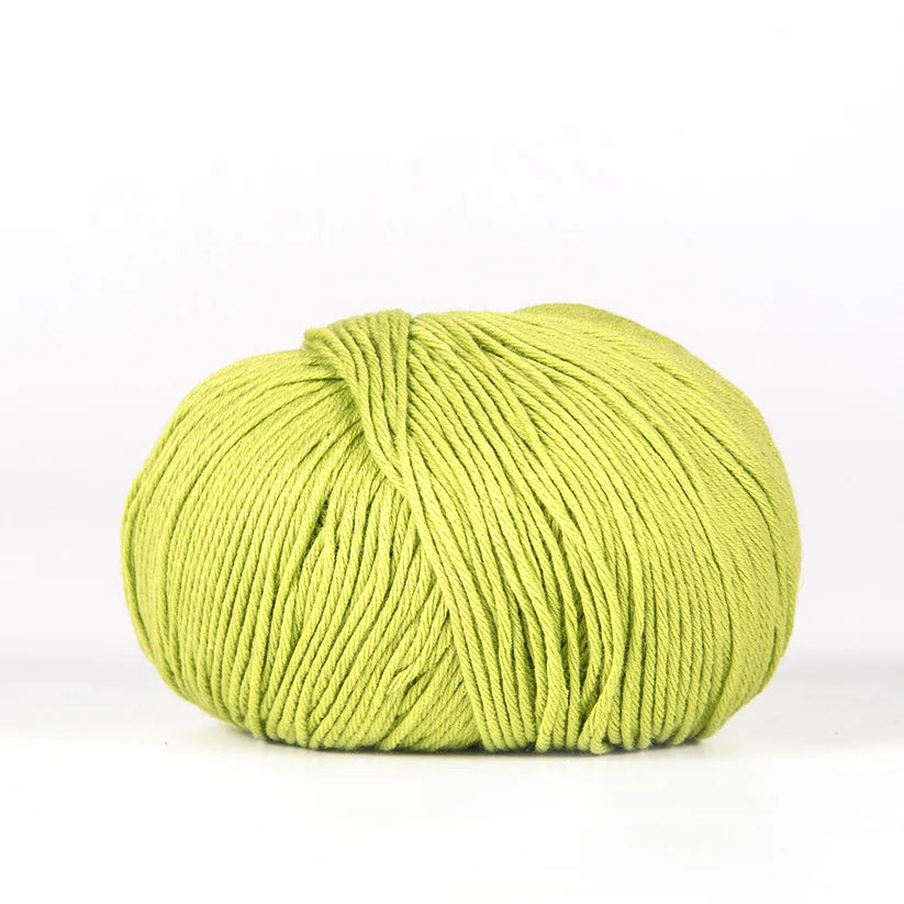 Ball of lime green BC Garn Alba yarn.