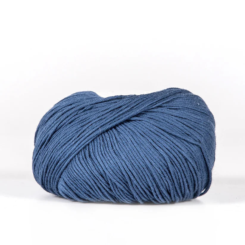 Ball of medium blue BC Garn Alba yarn.