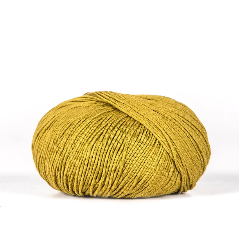 Ball of mustard yellow BC Garn Alba yarn.