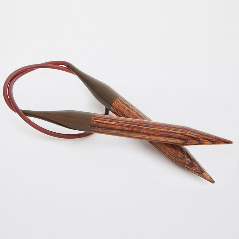 Brown wooden circular needles connected by a brown cord.