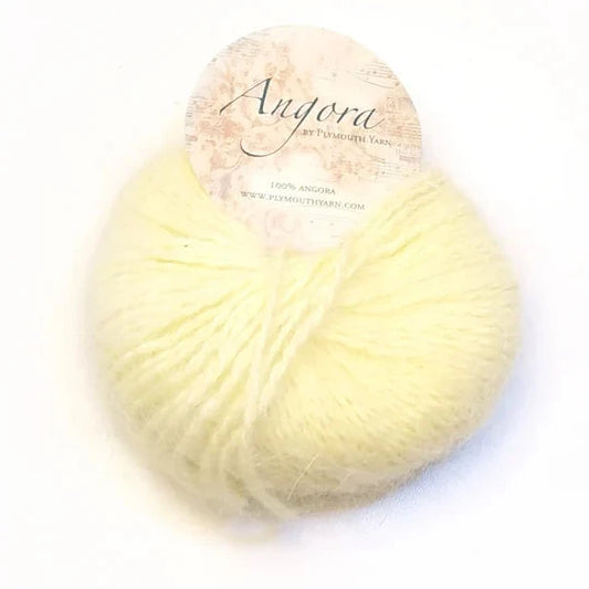 Ball of pastel yellow Plymouth Angora yarn.