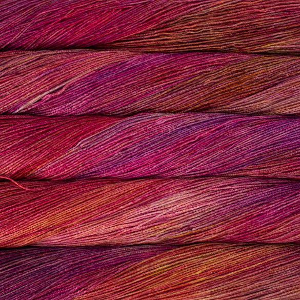 Variegated skeins of magenta red and orange yarn - Ultimate Sock by Malabrigo in Zinnias