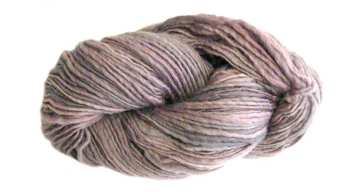 Brown and pink skein of Manos del Uruguay Wool Clásica yarn.