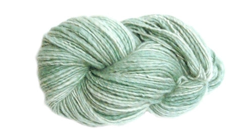 Mint green skein of Manos del Uruguay Wool Clásica yarn.