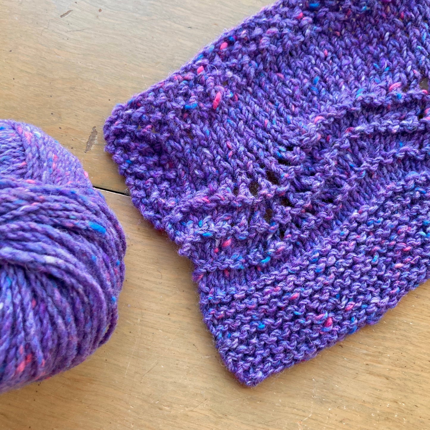 Purple ball of Plymouth Tweed yarn and swatch