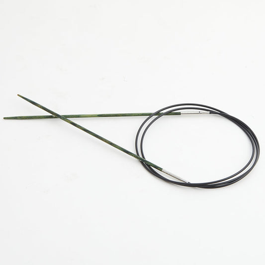 Green circular knitting needles, connected by a black cord.