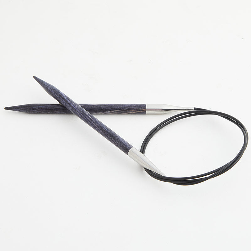 Gray blue circular knitting needles, connected by a black cord.