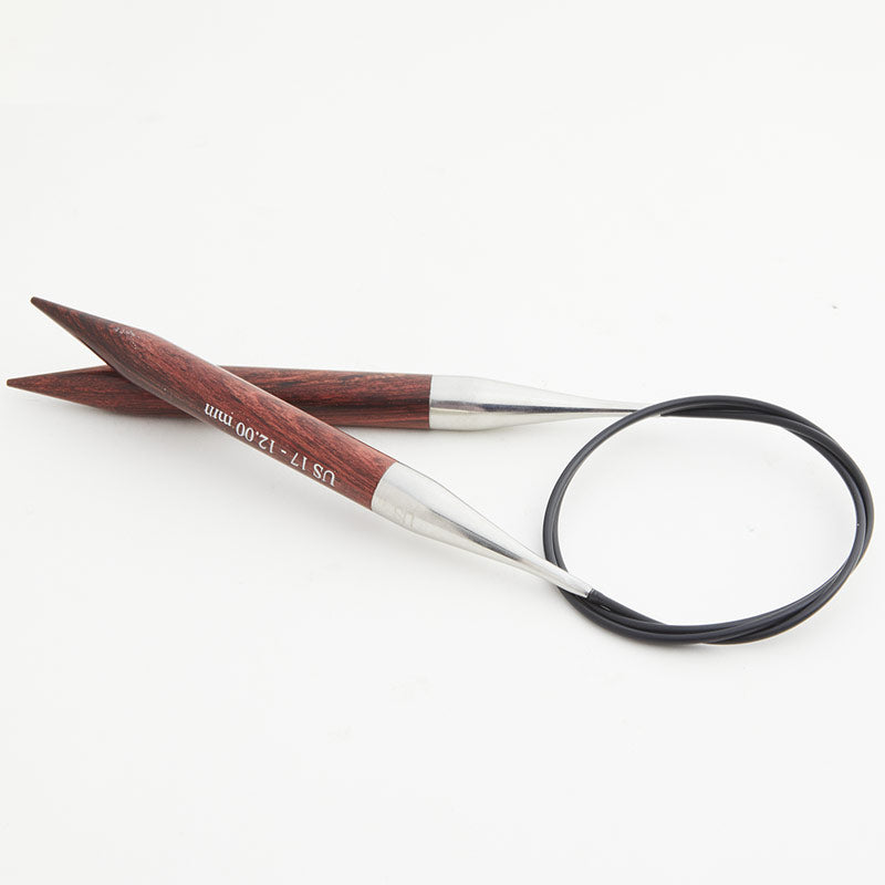 Brown circular knitting needles, connected by a black cord.