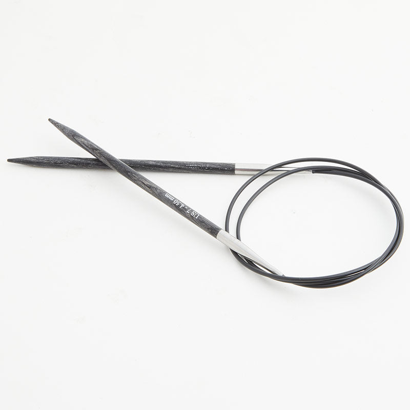 Gray circular knitting needles, connected by a black cord.