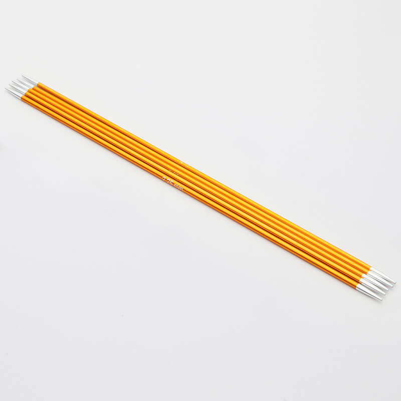 Set of 5 gold Zing double pointed neeedles with silver tips.