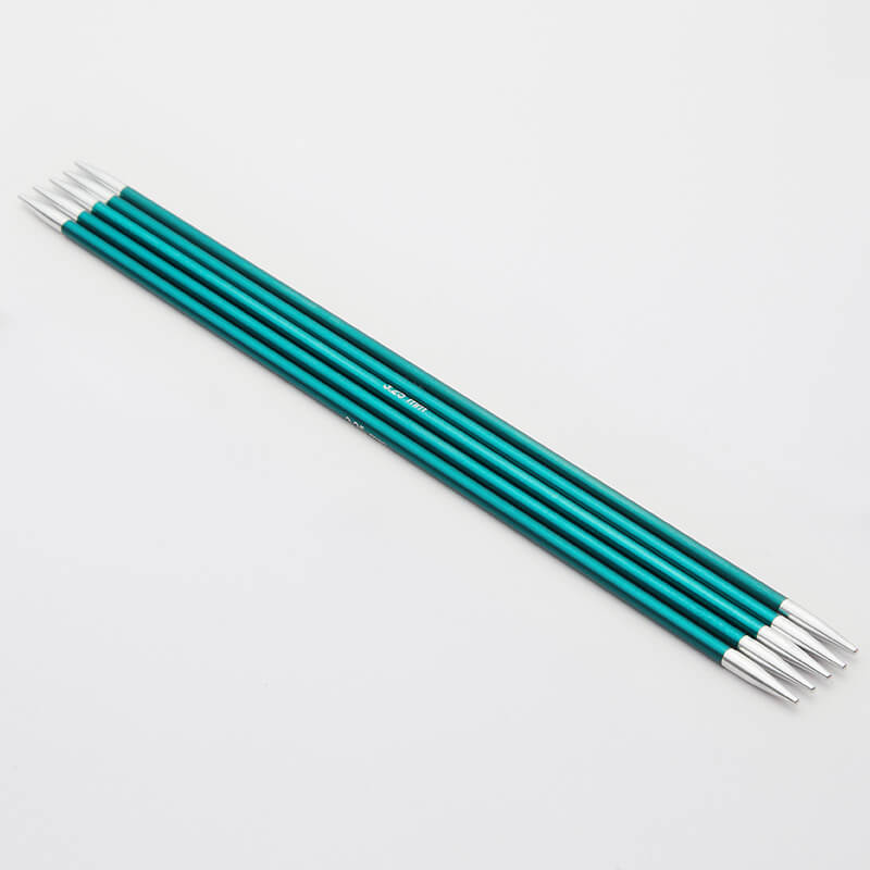 Set of 5 teal Zing double pointed neeedles with silver tips.