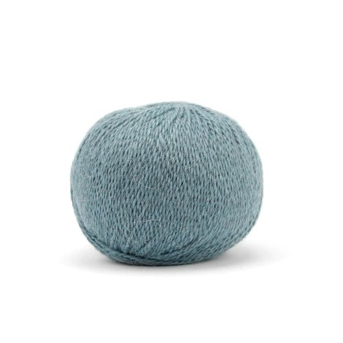 Ball of light heathered blue Pascuali Balayage yarn. 