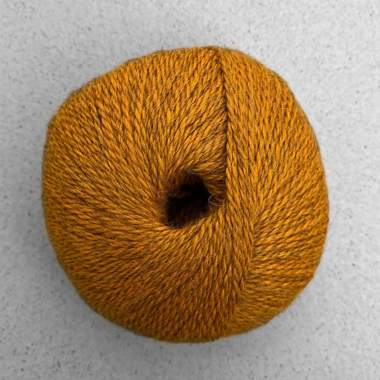 Ball of mango orange Pascuali Balayage yarn. 