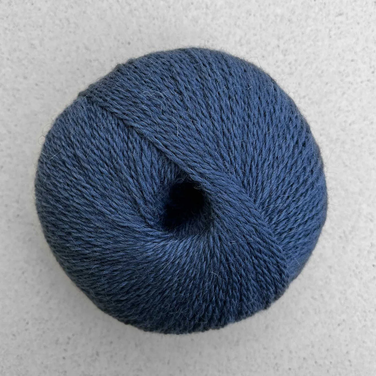 Ball of denim blue Pascuali Balayage yarn. 