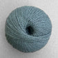 Ball of heathered light teal Pascuali Balayage yarn. 