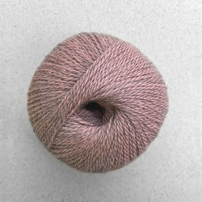 Ball of heathered peach Pascuali Balayage yarn. 