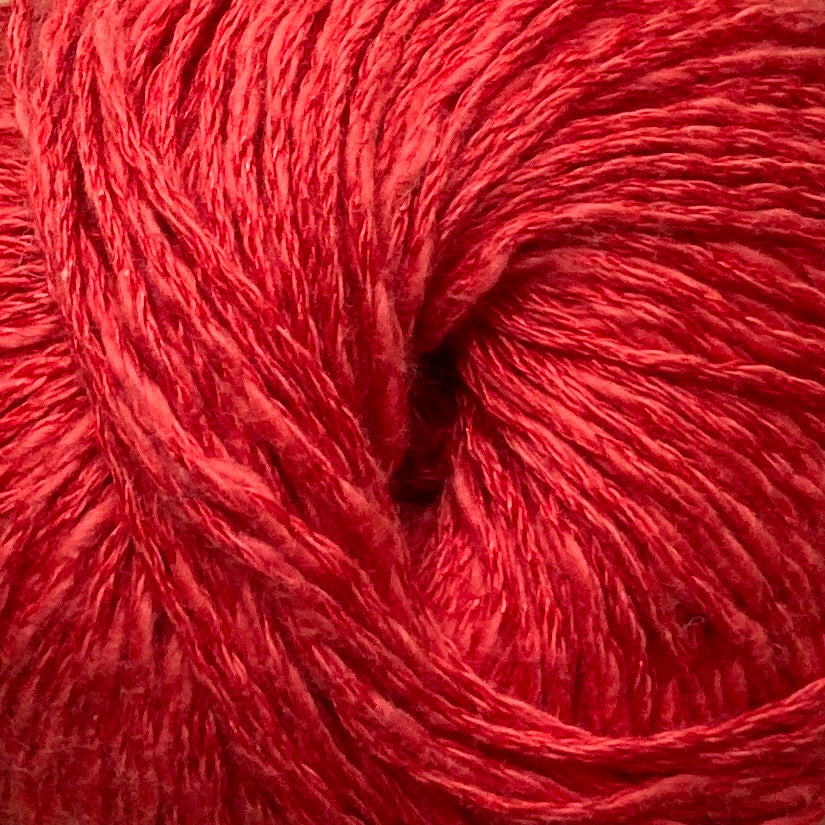 Close up on a bright red ball of Katia Liana yarn. 