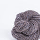 Gray brown ball of Brooklyn Tweed Loft yarn. 