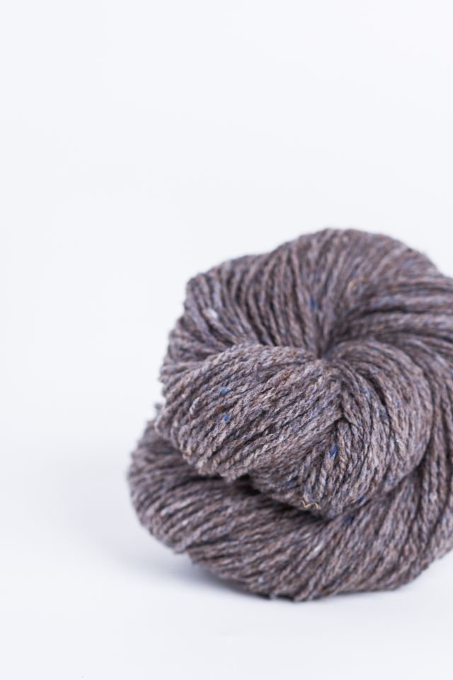 Gray brown ball of Brooklyn Tweed Loft yarn. 