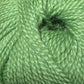 Close up on a ball of bright green Jo Sharp Alpaca Kid Lustre yarn. 