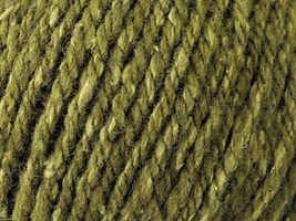 Close up on moss green ball of Elsebeth Lavold Silky Wool XL yarn. 