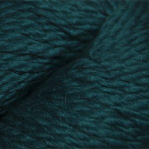 Close up on a skein of deep green Cascade Baby Alpaca Chunky yarn. 