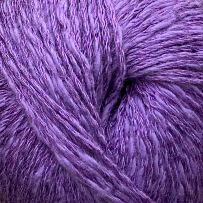 Close up on a purple ball of Katia Liana yarn. 