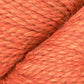 Close up on skein of Berroco Ultra Alpaca Chunky yarn in orange. 