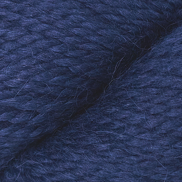 Close up on skein of Berroco Ultra Alpaca Chunky yarn in navy. 