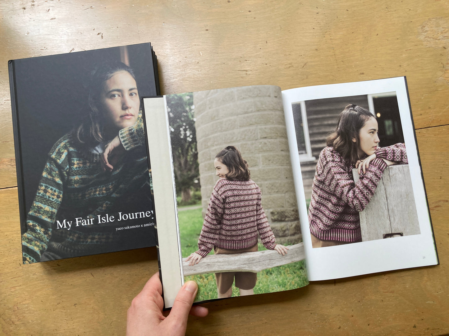 Yuco Sakamoto’s My Fair Isle Journey book, lying open to a photo of people wearing colorful fair isle garments. 