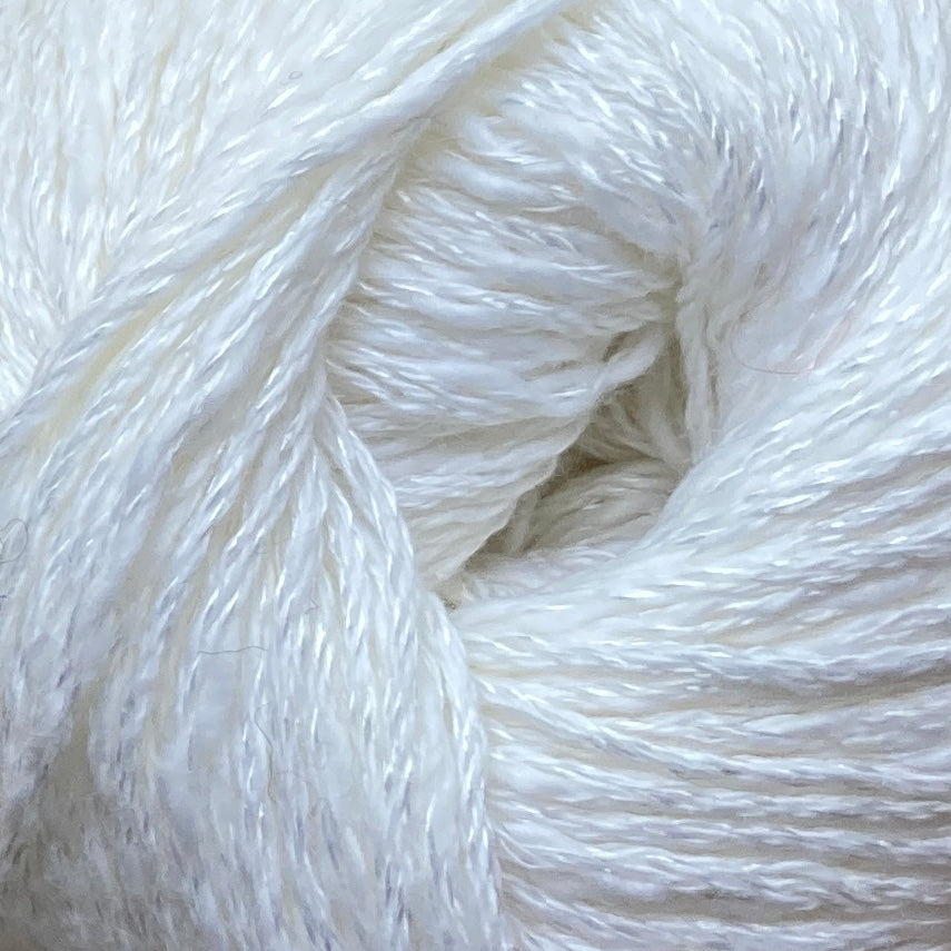 Close up on a white ball of Katia Liana yarn. 