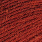 Close-up image of bambouclé yarn from Elsebeth Lavold in warm red.