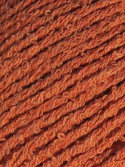 Close-up image of bambouclé yarn from Elsebeth Lavold in burnt orange.