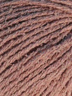 Close-up image of bambouclé yarn from Elsebeth Lavold in dusty rose.