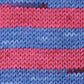 Knit swatch with pink, purple, and blue stripes. 