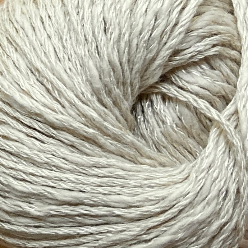 Close up on a beige ball of Katia Liana yarn. 