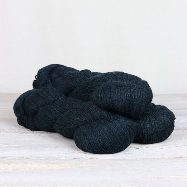 3 skeins of dark teal Fibre Co. Cumbria Fingering yarn. 